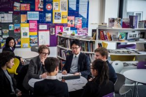 A group of students working at a table in the careers centre.