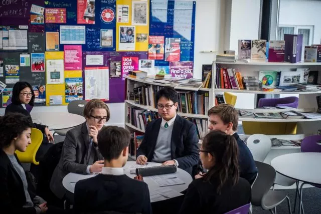 A group of students working at a table in the careers centre.