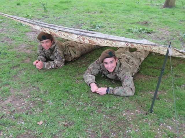 Two pupils under a tent in their CCF uniform