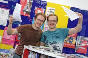 Two pupils celebrate their A Level results in the careers centre