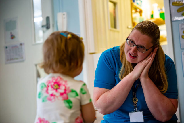 child in The Elms nursery being supervised by a member of staff