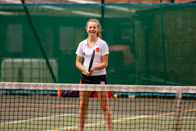 A Trent College pupil playing tennis