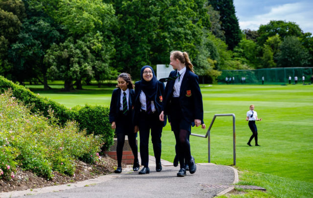 A group of girls walking outside at Trent College