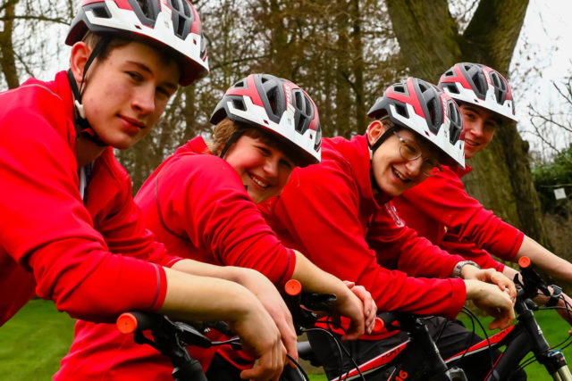 A group of students enjoying mountain biking in the school grounds