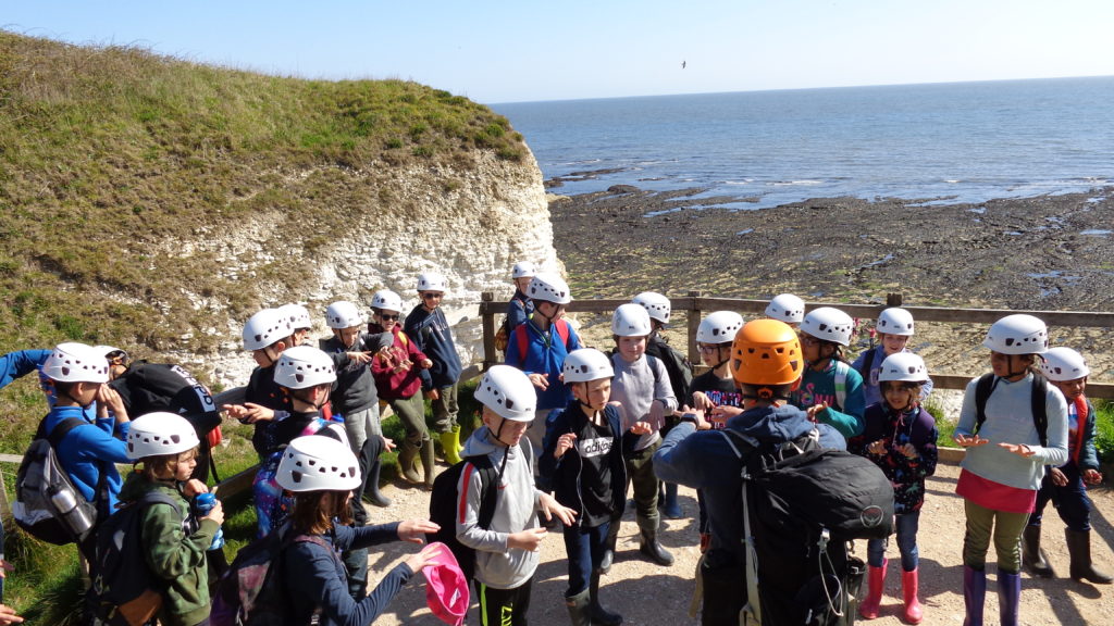 Year 5 Pupils on the coast on a school trip to Cranedale, Yorkshire