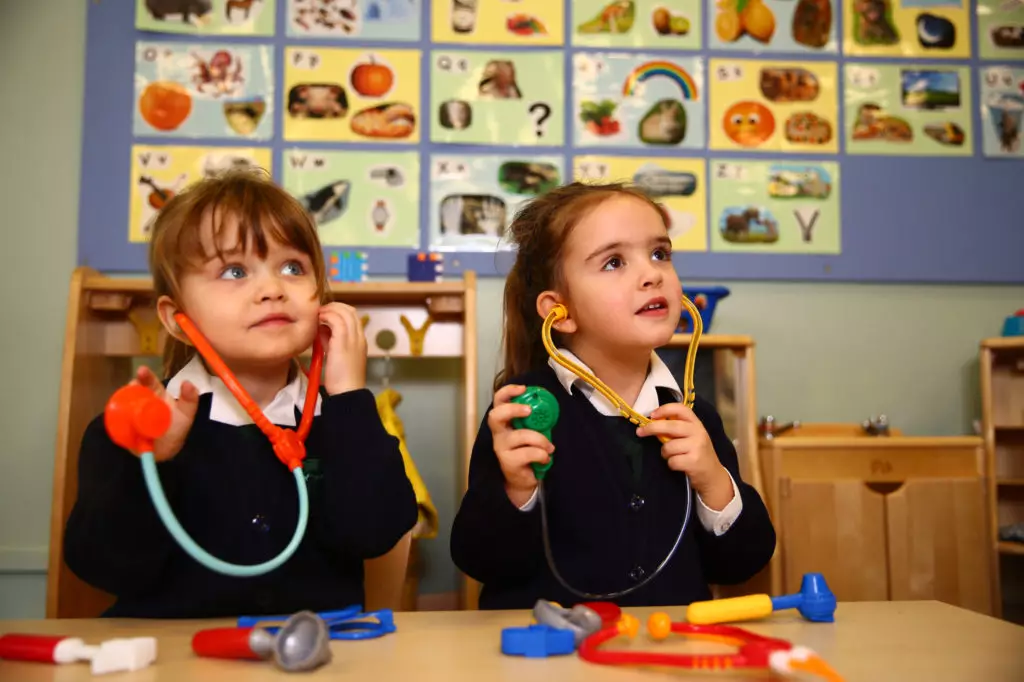 Two pre-school children with toy stethoscope