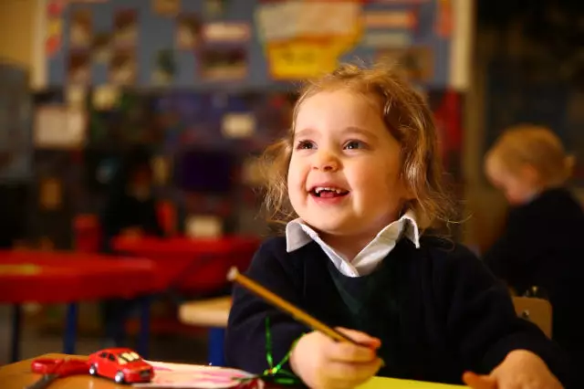 Pre-school child holding a pencil