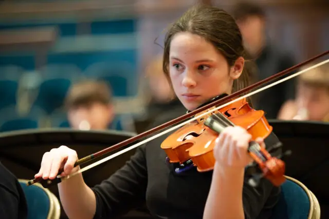 Lower school pupil plays violin at the Albert Hall