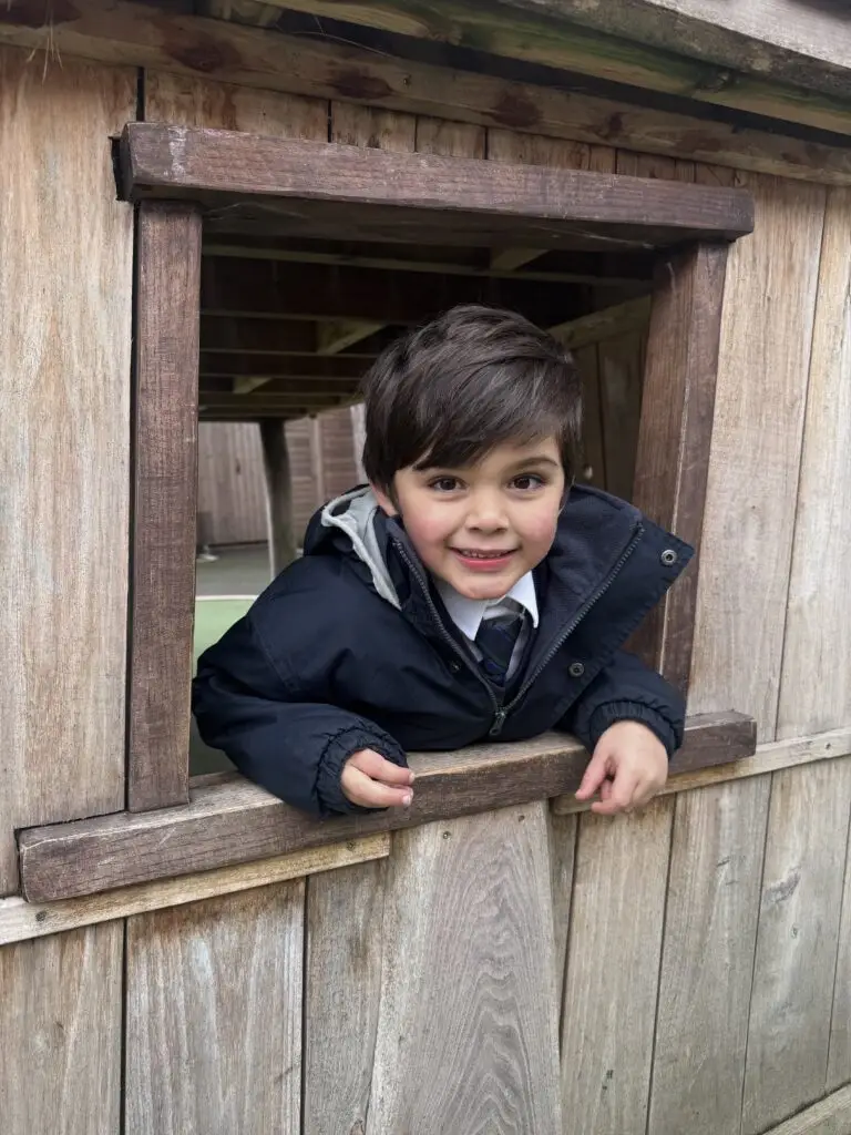 Elms boy in play house